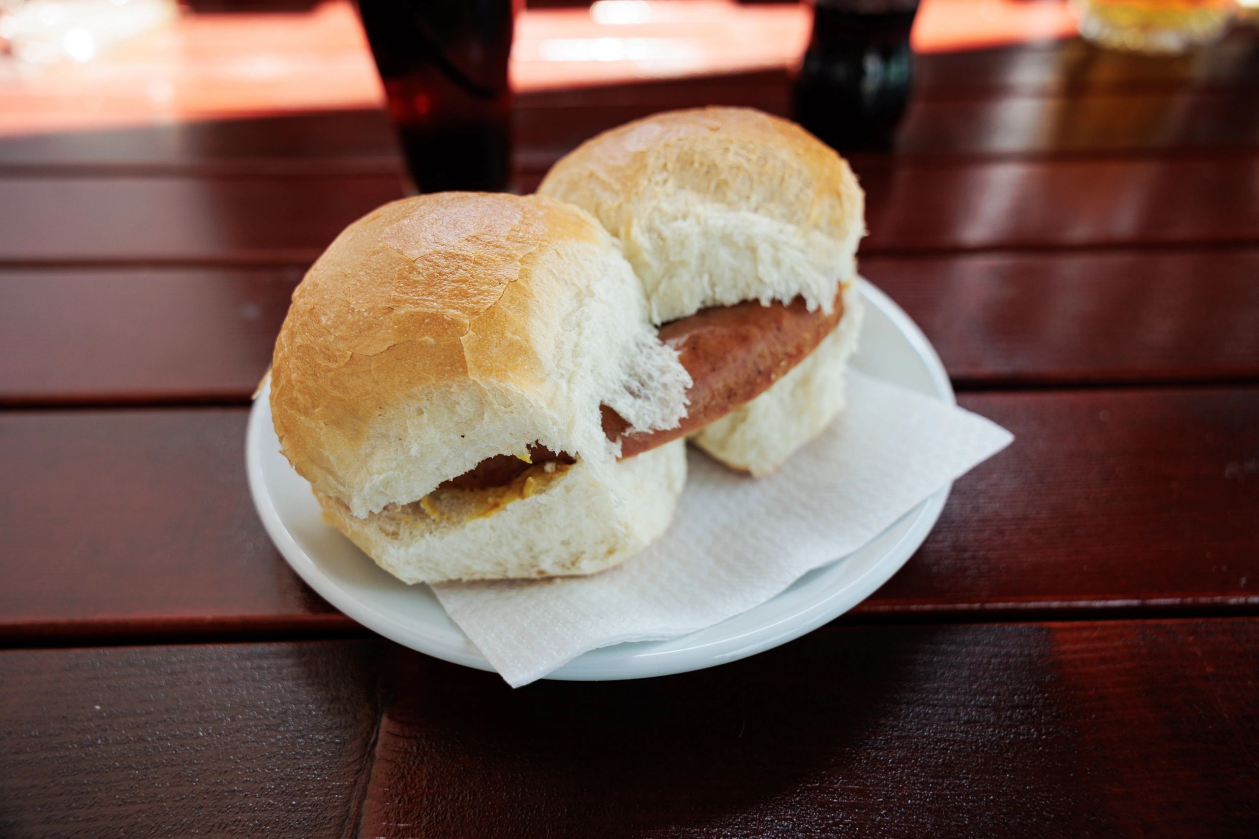 Loaded sandwich on a red wooden table