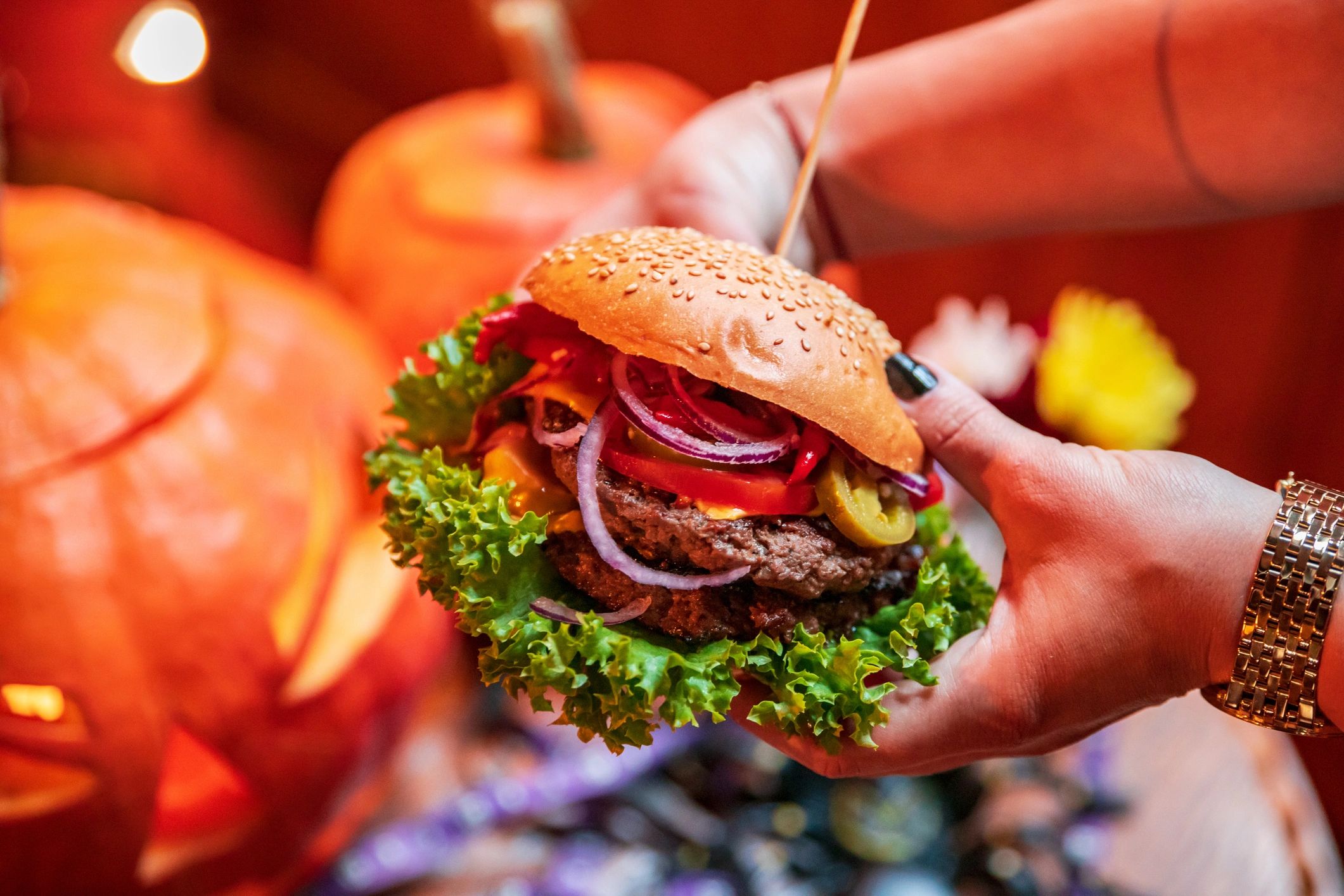 Juicy burger served on a wooden plate