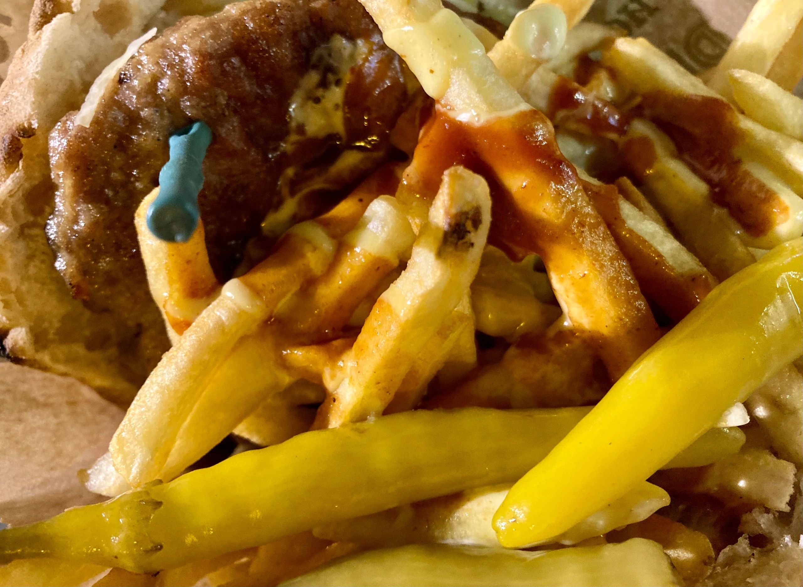 Burger with fries served street-food style
